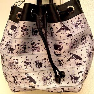 Harvey’s crossbody bag and backpack. It is a Disney steamboat willie theme.